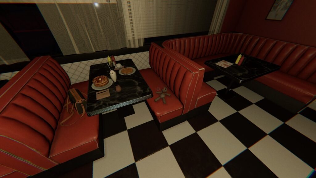 A voodoo doll sits on a red diner seat in Phasmophobia's Nell's Diner map.