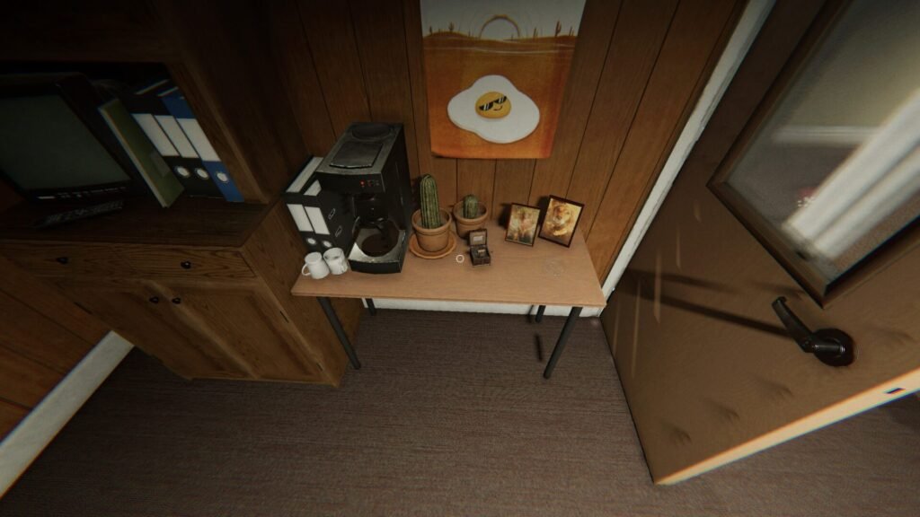 A music box sits on a table near some cactus, photos of dogs, and a coffee machine in Phasmophobia's Nell's Diner map.