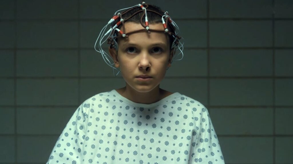 A young Eleven being tested in Papa's lab.
