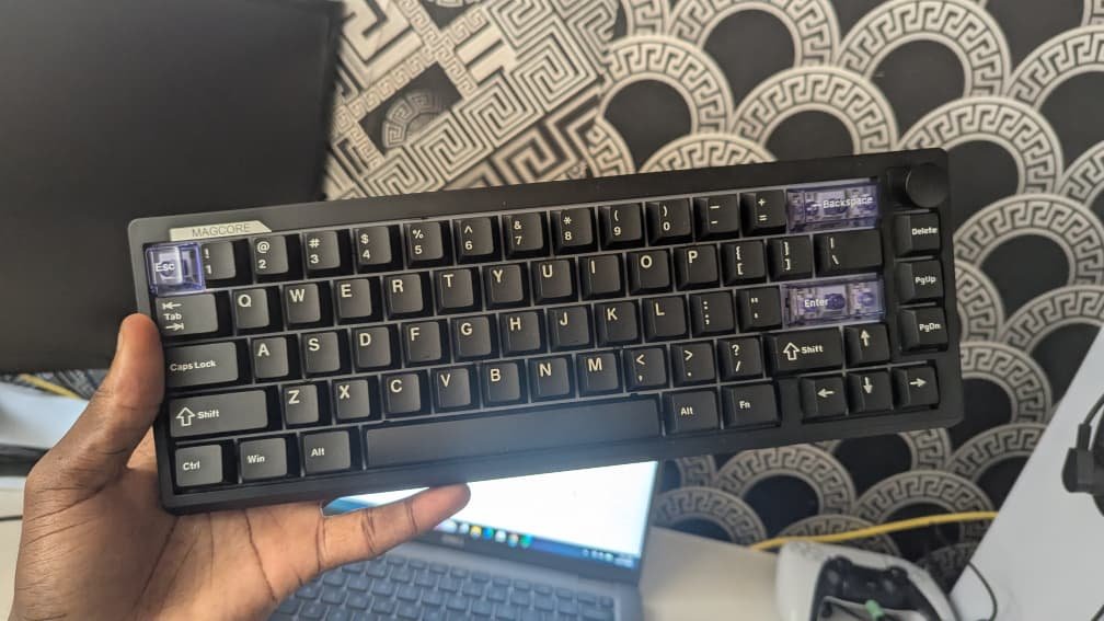 holding a Epomaker Magcore65 Lite keyboard