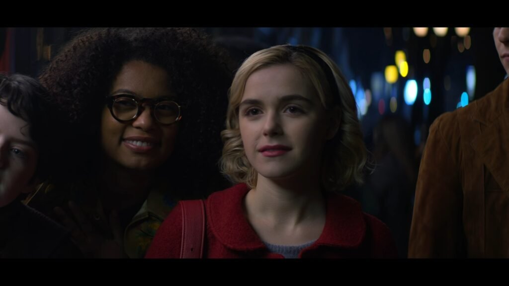 Sabrina Spellman and her friends in the Chilling Adventures of Sabrina on a dark street.