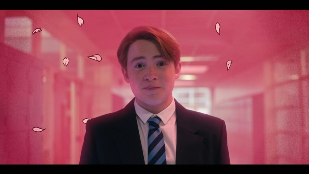 Nick in Heartstopper season one showing a pink background and drawings around him.