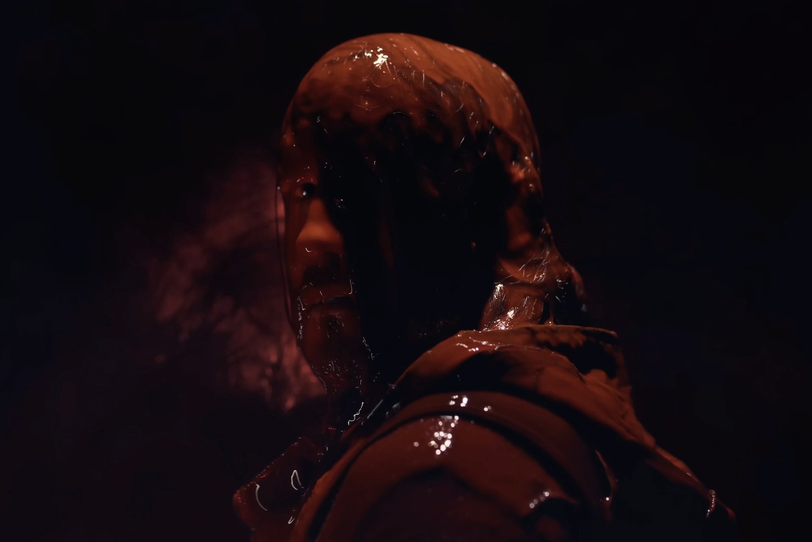 Simon from Iron Lung drenched in blood and looking at the camera