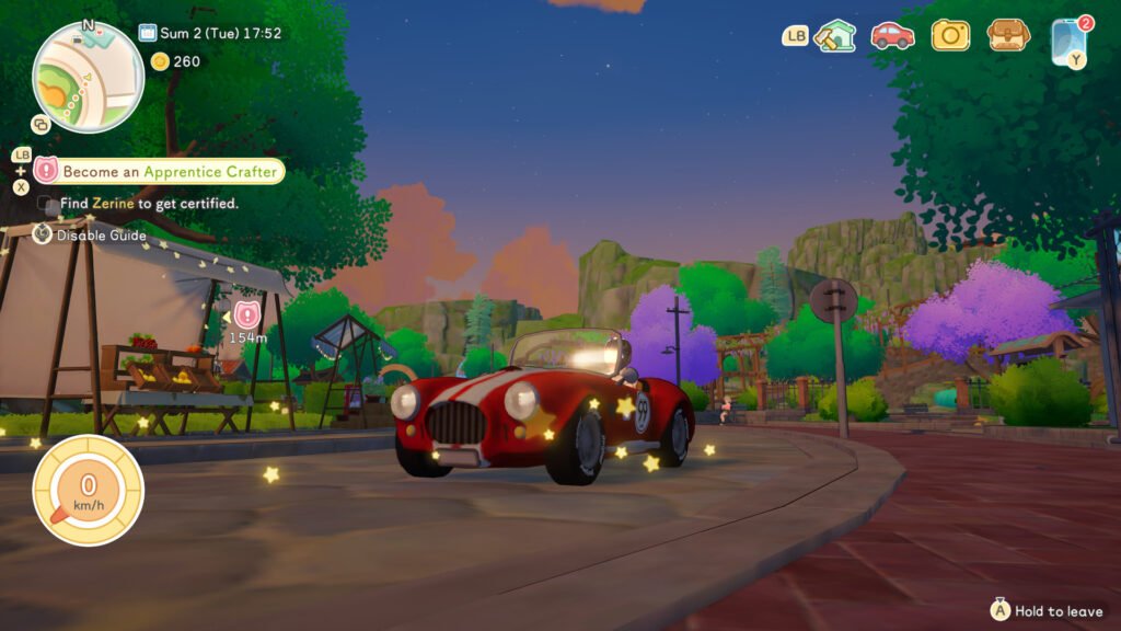 A red sportscar being driven around Starsand Island at sunset.