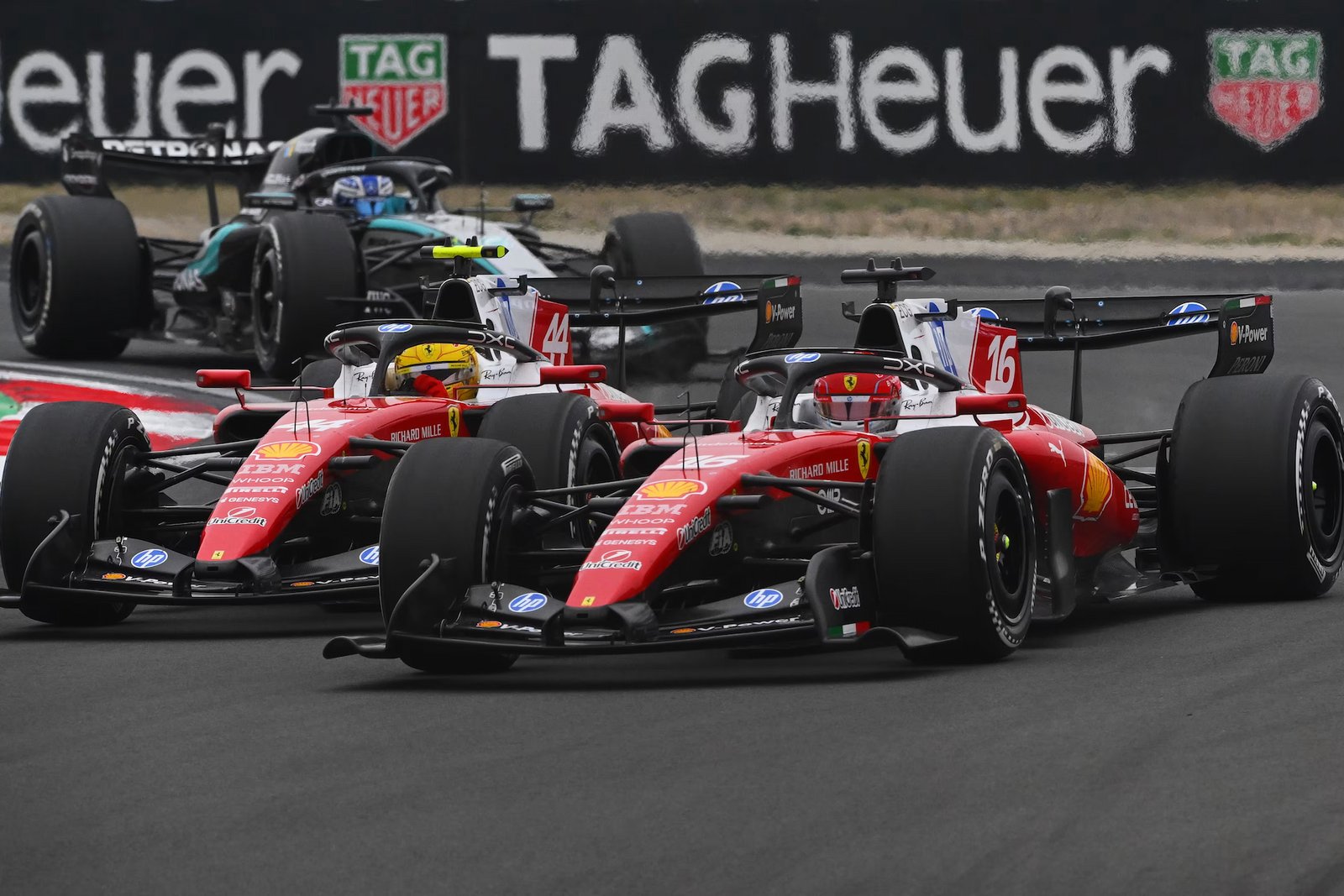 2 ferrari cars on track battling during the chinese Grand Prix