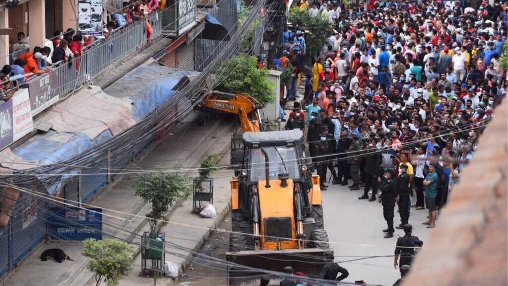 Balen's officers using Bulldozer to demolish buildings in Kathmandu