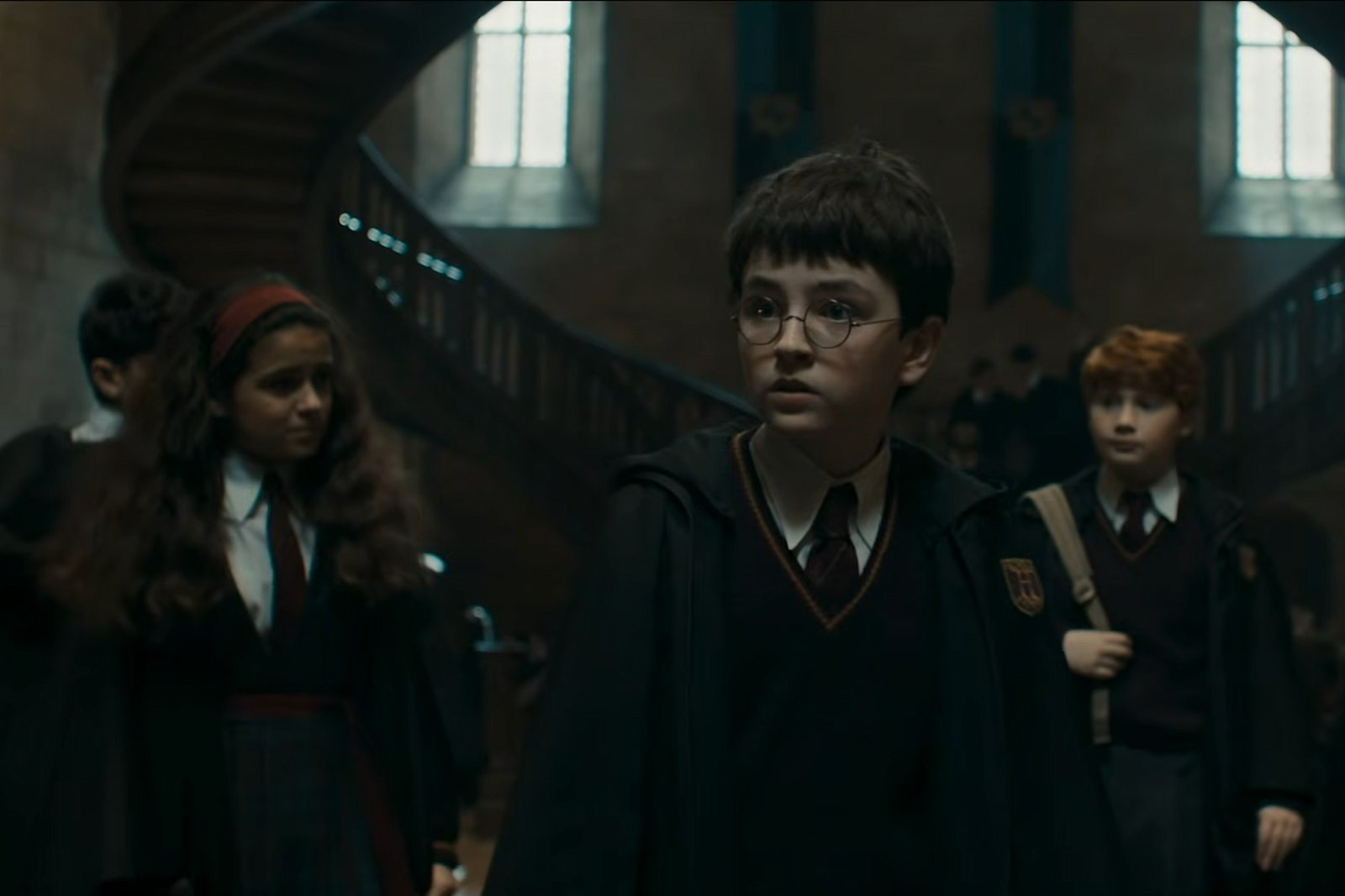 Harry, Ron and Hermione walking in Hogwarts in the new Harry Potter trailer